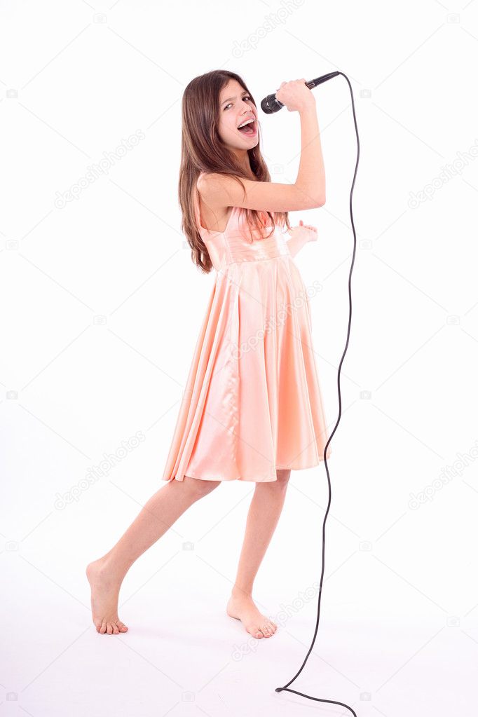 Teen girl with microphone — Stock Photo © Alexandra Lande #9561404