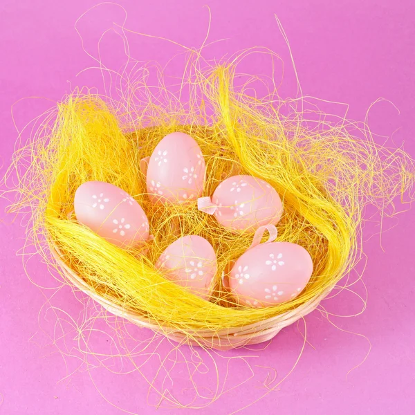 stock image Pink eggs in the basket