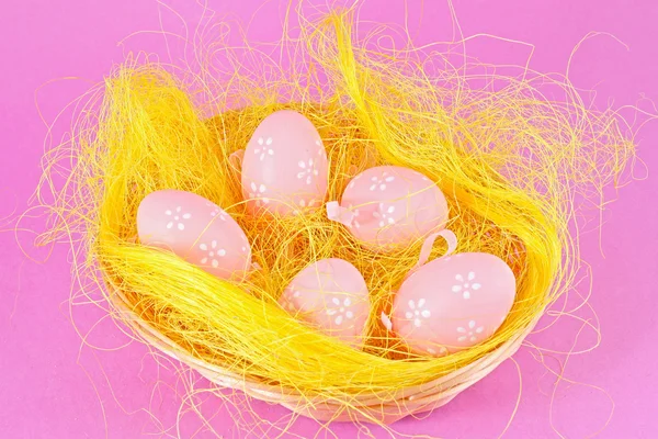 stock image Pink eggs in the basket