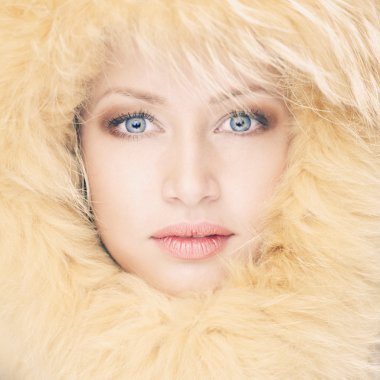 Young woman in fur hat clipart