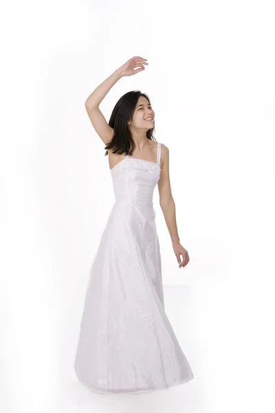 stock image Beautiful young teen girl in white dress or gown twirling