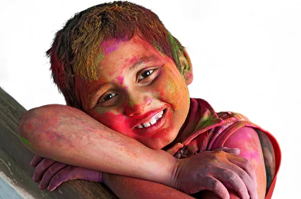 stock image Close up face of young boy playing Holi, smiling colors, white B