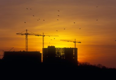 Sunset at the construction site. clipart