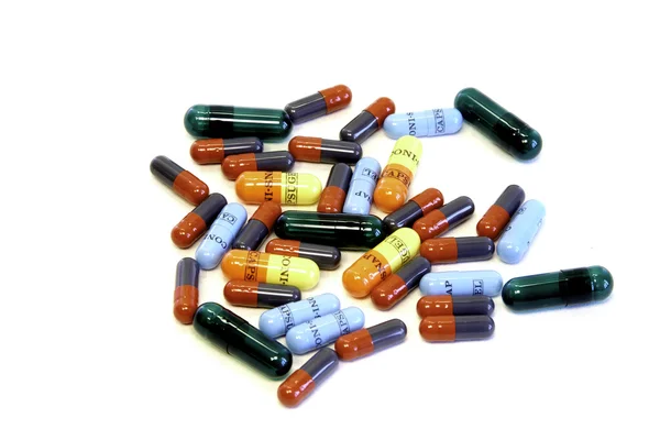Comprimidos em cápsulas em branco — Fotografia de Stock