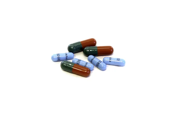 Pills in capsules at white blank — Stock Photo, Image