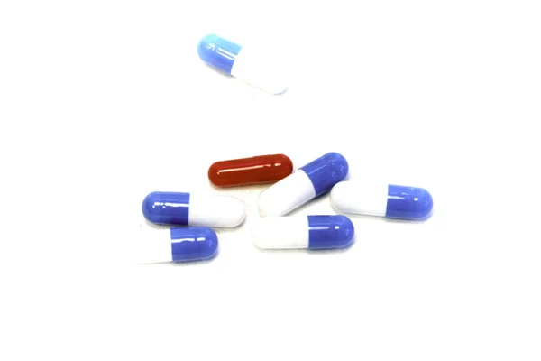 Pills in capsules at white blank — Stock Photo, Image