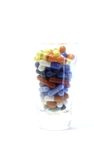 Pills in glass — Stock Photo, Image