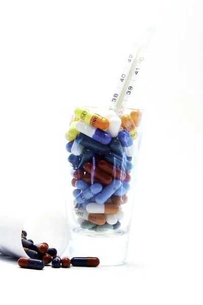Pills in glass — Stock Photo, Image