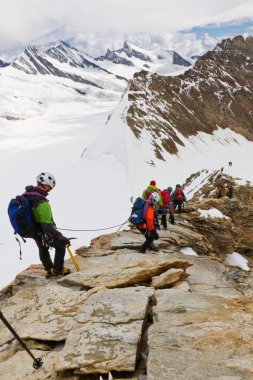 Scaling 4107m high mountain Moench, Switzerland clipart