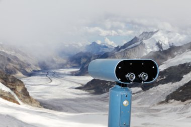 Binoculars over Aletsch glacier, Switzerland clipart