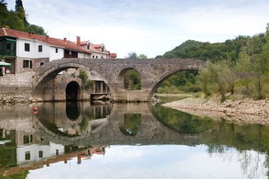 Old bridge in the village Rijeka Crnojevica, Montenegro clipart