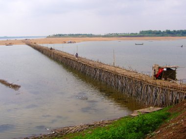 Long bamboo bridge from Kampong Cham to island clipart