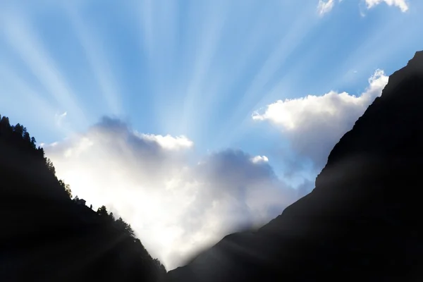 stock image Sun bursts though clouds