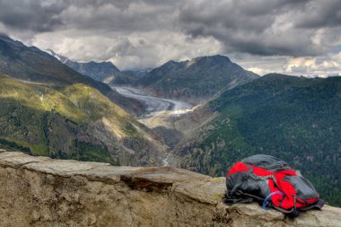 Hiking backpack above Aletsch glacier clipart