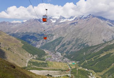 Saas Fee town with cable car clipart