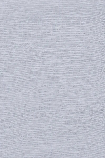 Біла медична пов'язка марлевої текстури, абстрактний текстурований фон — стокове фото