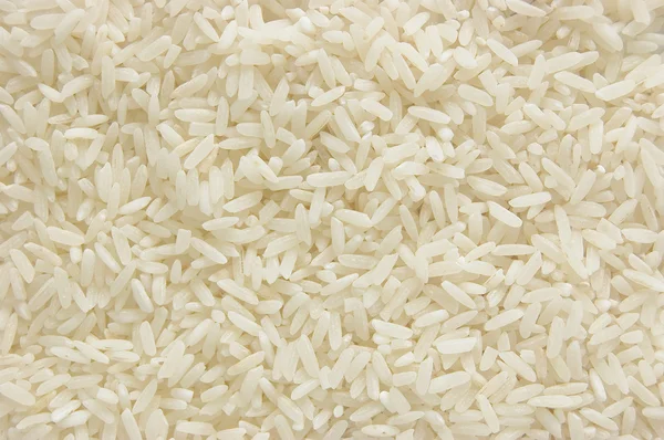 Fondo lungo riso bianco, cereali crudi crudi crudi, primo piano macro — Foto Stock