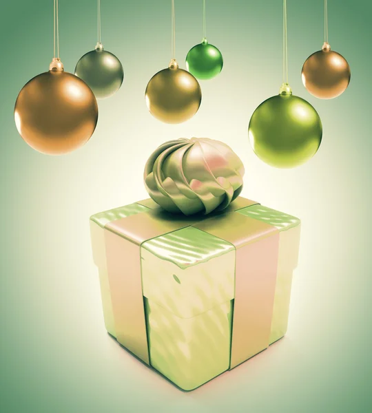 Boules et cœurs de Noël avec boîte cadeau sur fond vert — Photo