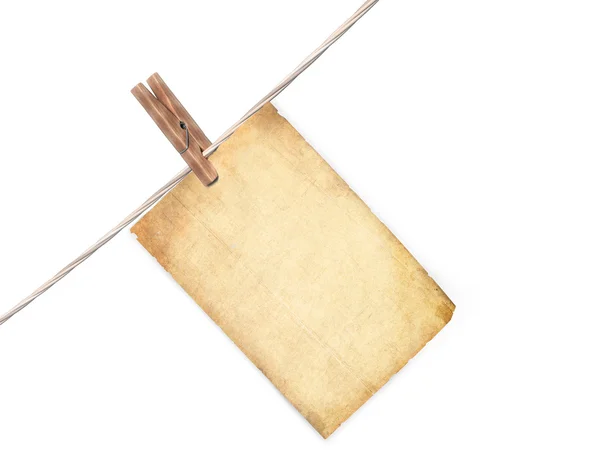 Old blank paper sheet hanging on a rope — Stock Photo, Image