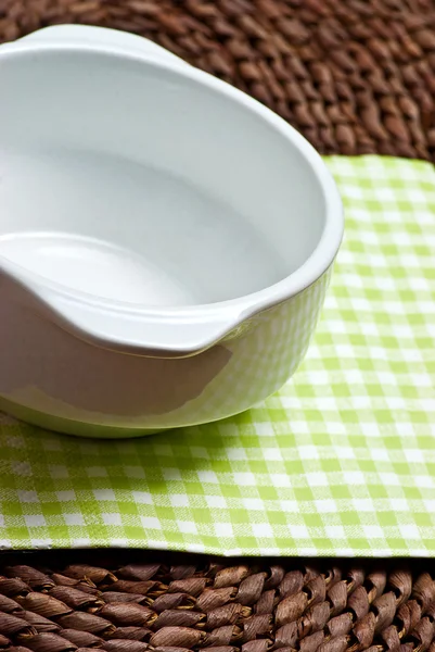 Empty bowl on grass mat — Stock Photo, Image