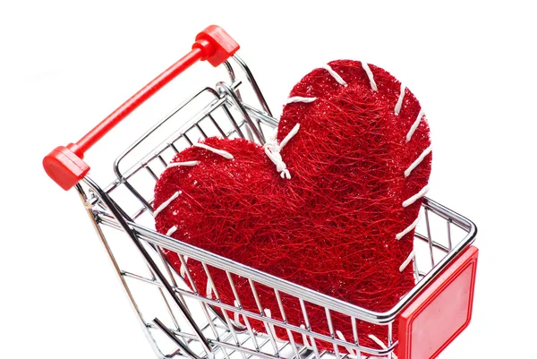Winkelwagen en rood hart — Stockfoto