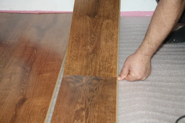 stock image Laying a sheet of laminate