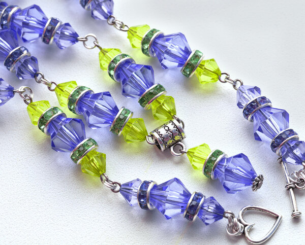 Purple beads, with green stones