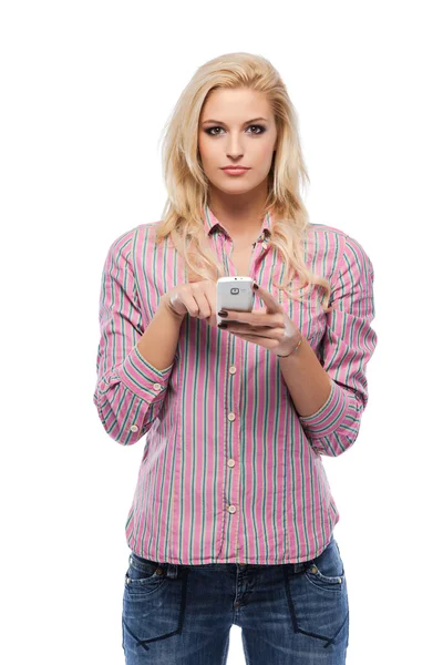 Blonde woman with her cellphone in studio — Stock Photo, Image