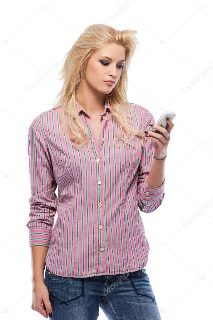 Serious blonde woman holding a cellphone