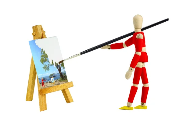 Mannequin painting a landscape isolated on white — Stock Photo, Image