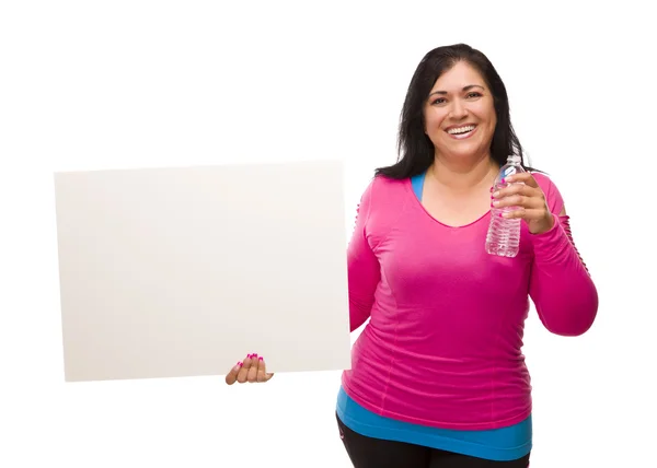 Hispanic Woman In Workout Clothes with Water and Blank Sign — Stock Photo, Image