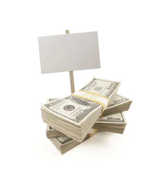 Pilhas de cem dólares de contas com sinal em branco — Fotografia de Stock