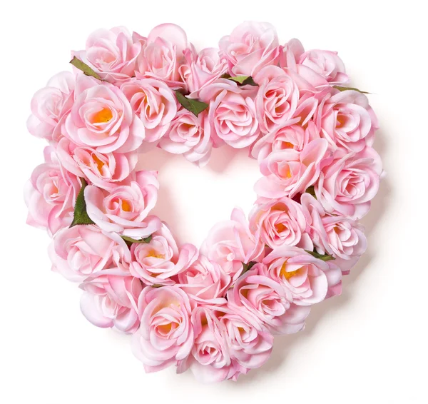 Růžové růže uspořádání na bílém ve tvaru srdce — Stock fotografie