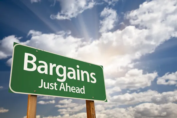 Bargains Just Ahead Green Road Sign and Clouds — Stock Photo, Image