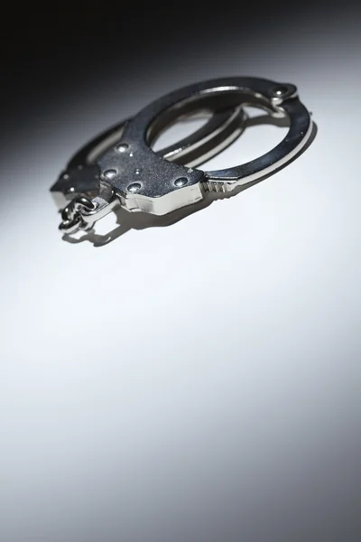 Abstract Pair of Handcuffs Under Spot Light - Text Room — Stock Photo, Image