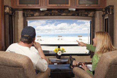 Couple Enjoy Beach View From RV clipart