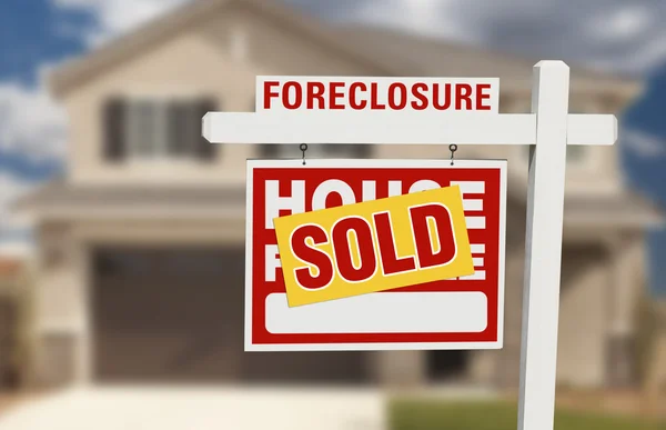 Sold Foreclosure Home For Sale Sign and House — Stock Photo, Image