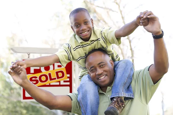 Father and Son In Front of Real Estate Sign — Stock Photo, Image