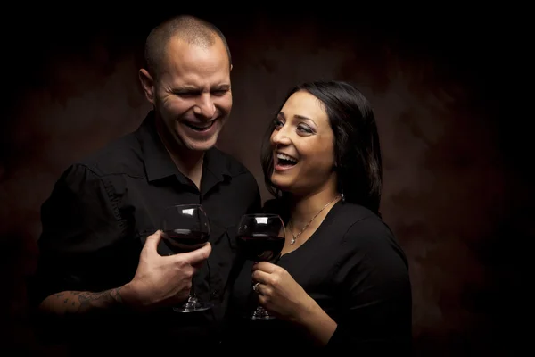 stock image Happy Mixed Race Couple Holding Wine Glasses