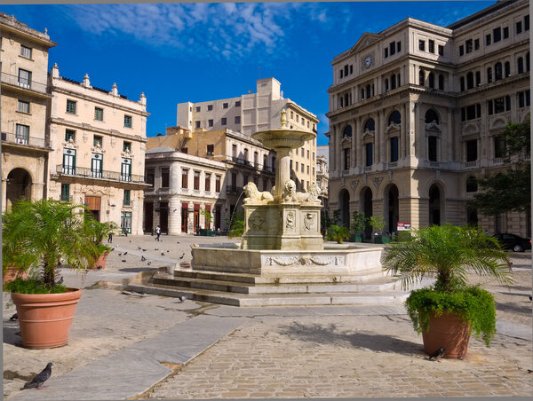 The San Francisco Square in Old Havana , a touristic landmark famous for its traditional architecture and ancient spanish palaces in Old Havana