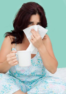 Hispanic woman sick with the flu clipart