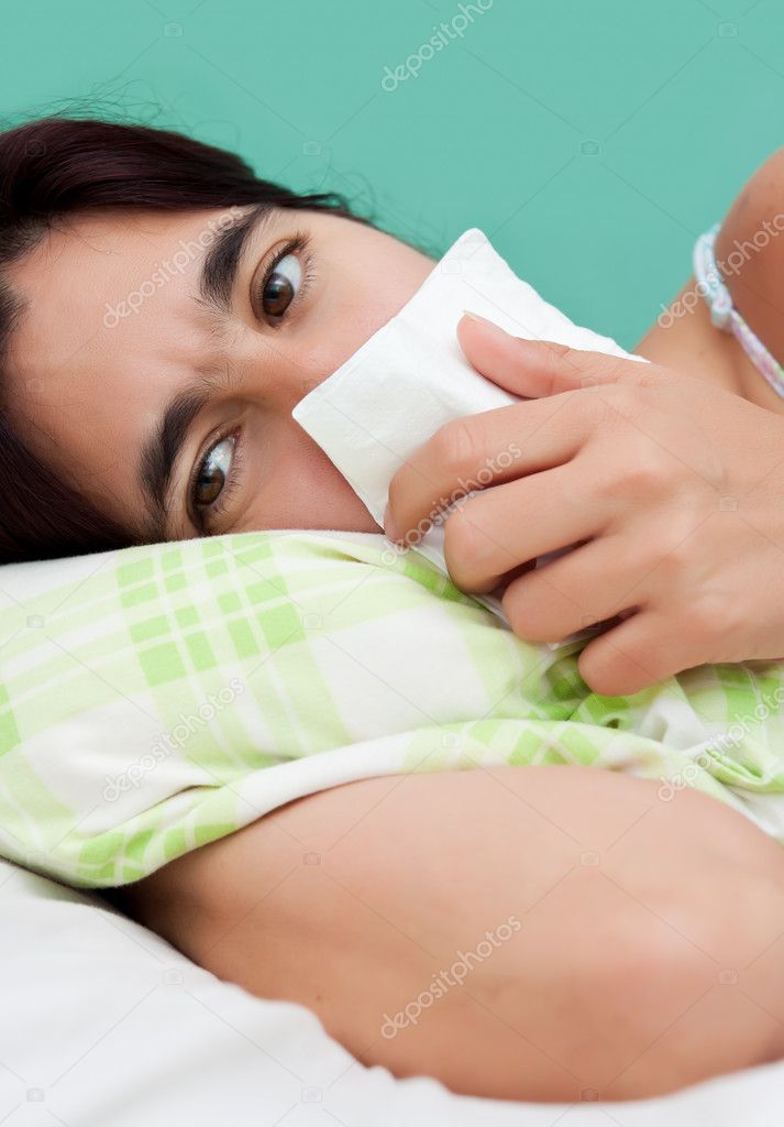 Hispanic woman sick with the flu