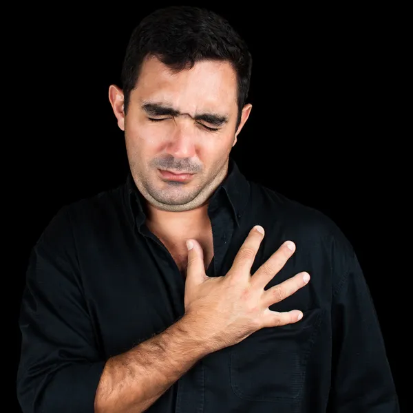 Young man feeling pain on his chest — Stock Photo, Image