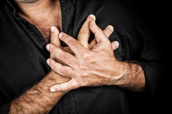 Nahaufnahme von zwei Händen, die eine Brust ergreifen — Stockfoto