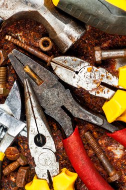 Set of tools on a rusty background clipart