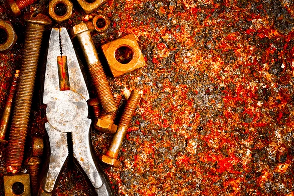 Old tools on a rusty background — Stock Photo, Image