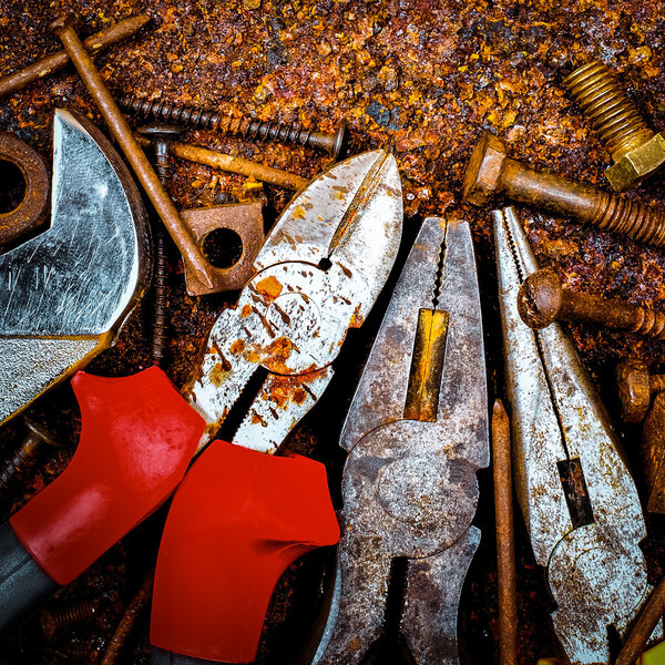 Tools on a rusty background