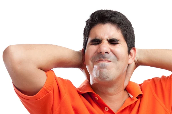 Hombre hispano muy estresado que sufre de dolor de cuello —  Fotos de Stock