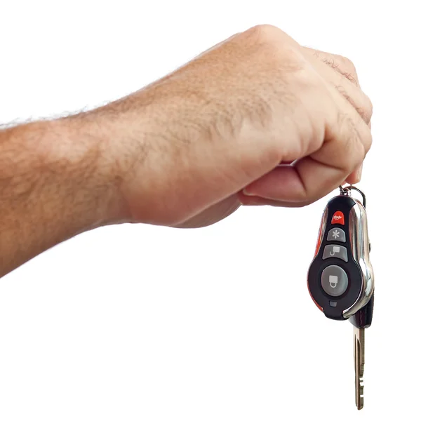 Mano sosteniendo nuevas llaves de coche aisladas en blanco — Foto de Stock