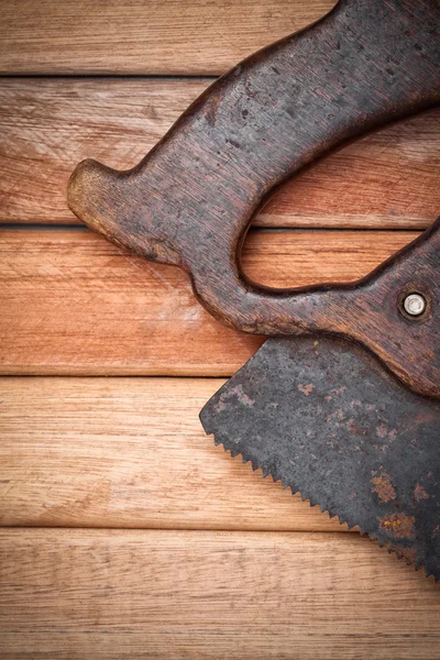 Handsaw over wooden boards — Stock Photo, Image